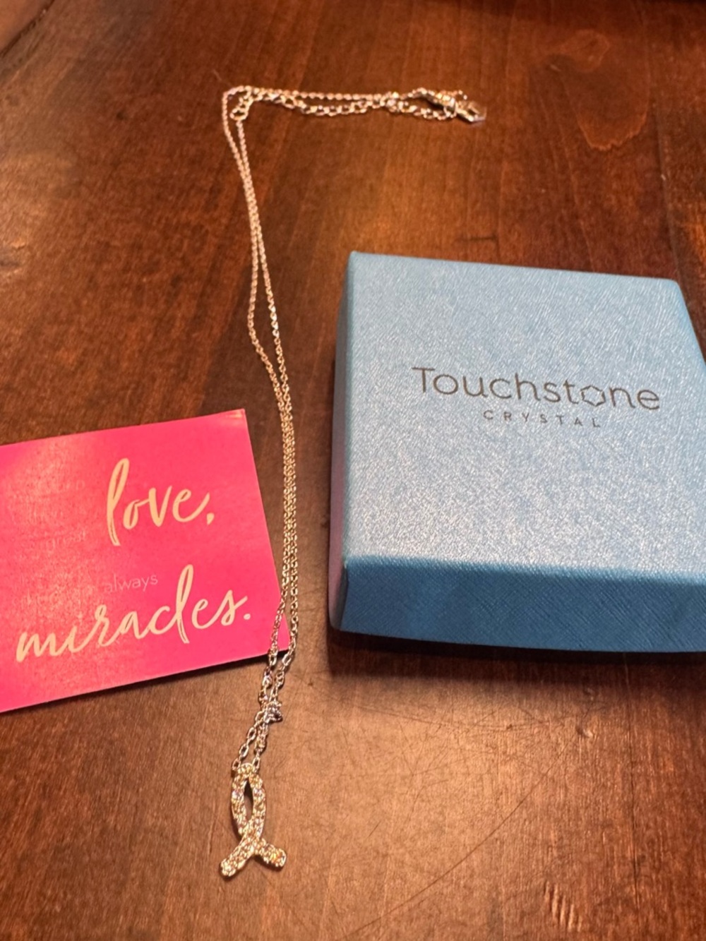 Touchstone Crystal Silver Ribbon Necklace. Breast Cancer Awareness.